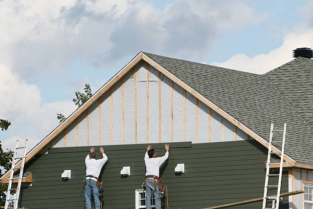 Professional Siding Replacement technician working in Longmont, CO